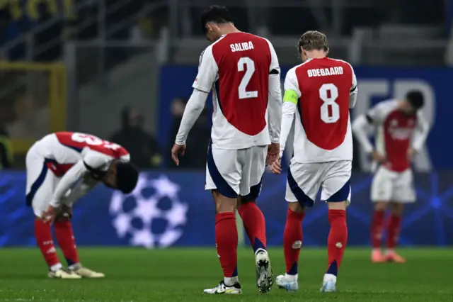 William Saliba and Martin Odegaard of Arsenal react with disappointment