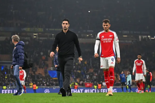 Mikel Arteta, Manager of Arsenal, and Ben White of Arsenal react at full-time