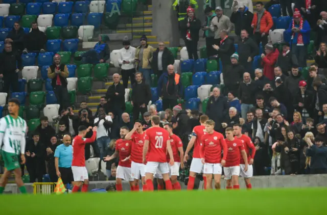 Larne players celebrate opening goal