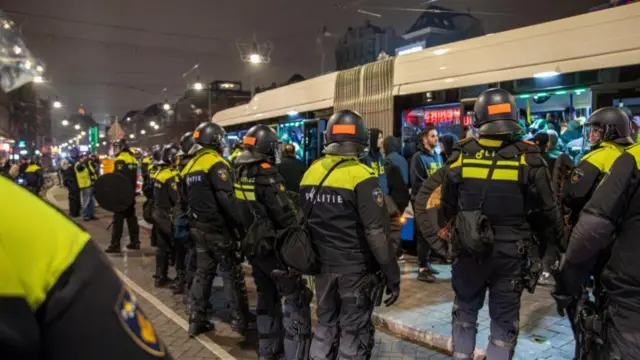 Police outside a tram in Amsterdam last night