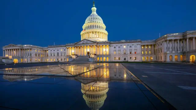 Congress seen at night with a reflection