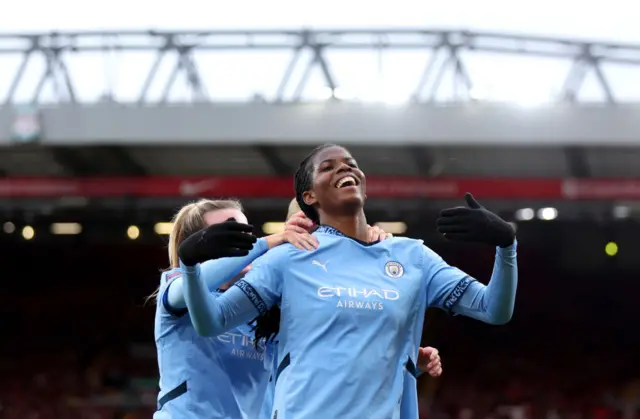 Khadija Shaw celebrates her late winner at Anfield with teammates