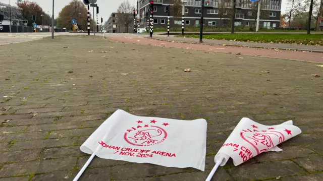 Flags on street outside stadium