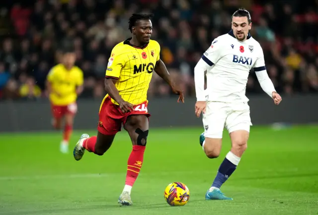 Watford's Kwadwo Baah (left) and Oxford United's Ciaron Brown battle for the ball