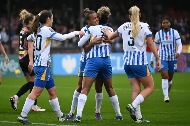 Brighton players celebrate with Nikita Parris after her goal v Leicester