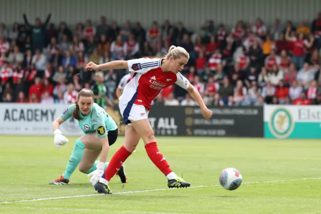 Alessia Russo scores for Arsenal after rounding Brighton keeper Sophie Baggaley