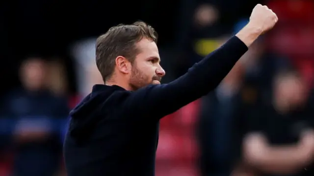 Watford head coach Tom Cleverley celebrates winning a game at Vicarage Road