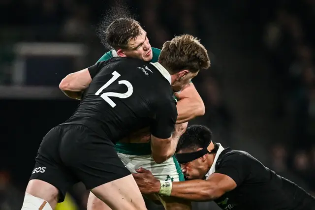 Jordie Barrett tackles Garry Ringrose