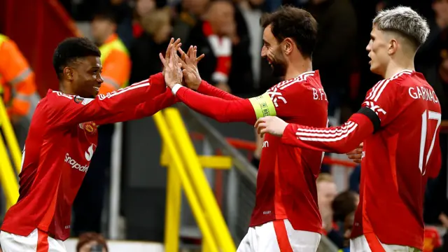 Bruno Fernandes congratulates Manchester United team-mate Amad Diallo after he scores against PAOK