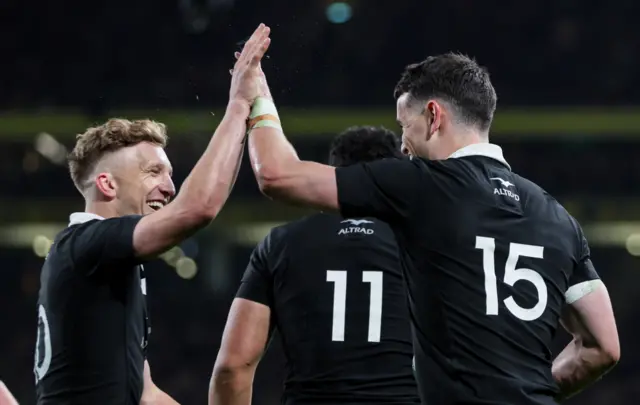 Jordie Barrett celebrates with Will jORDAN