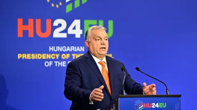 Hungarian prime minister Viktor Orban speaking at a podium at an EU leaders summit in Budapest, taken 8 Nov