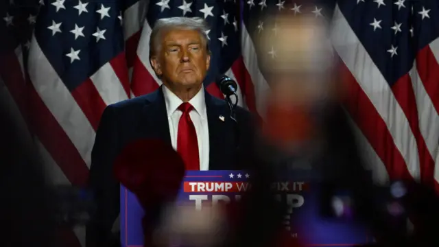 Republican presidential nominee and former U.S. President Donald Trump takes the stage following early results from the 2024 U.S. presidential election