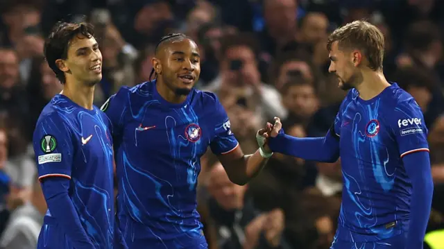 Christopher Nkunku celebrates with Joao Felix and Kiernan Dewsbury-Hall after scoring for Chelsea against Noah