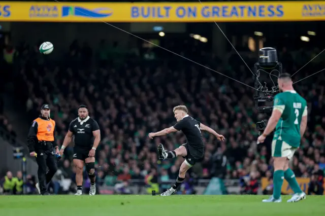 Damian McKenzie kicks a penalty