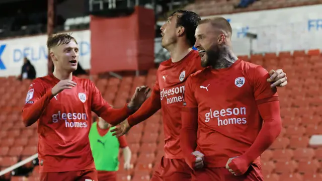 Barnsley's Stephen Humphrys and teammates celebrate winning goal against Rotherham