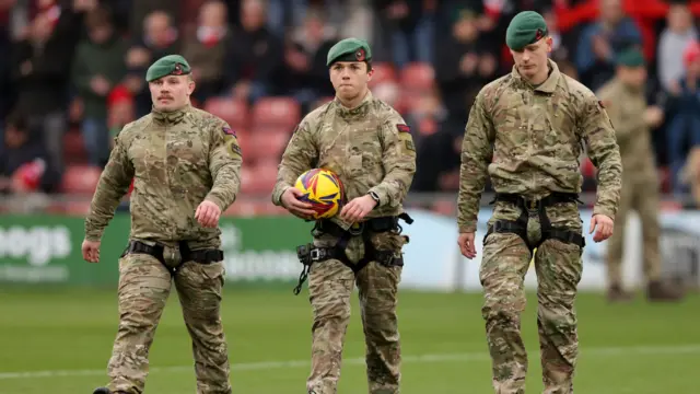 Royal Marines deliver the matchball at Wrexham