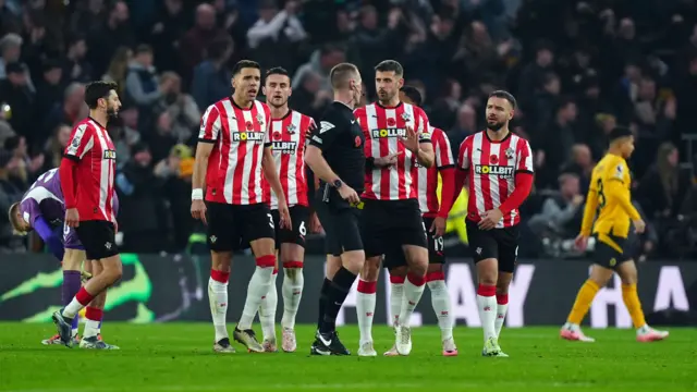 Southampton players contest Wolves' second goal.