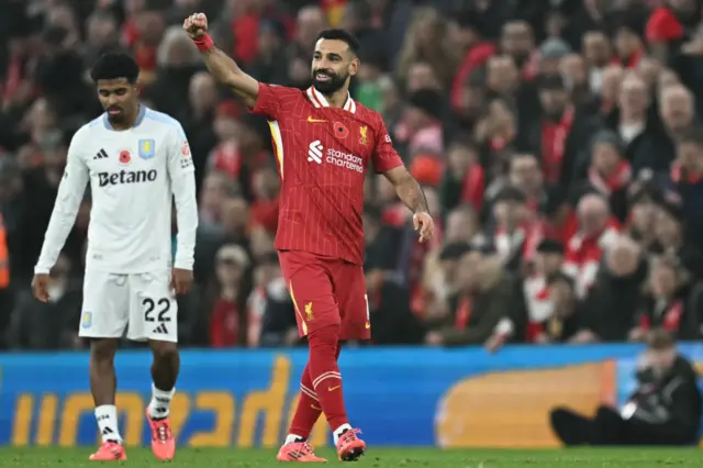 Mohamed Salah celebrates after putting Liverpool 2-0 in front against Aston Villa