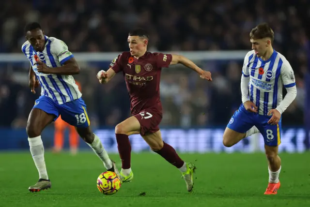 Foden drives forward with the ball