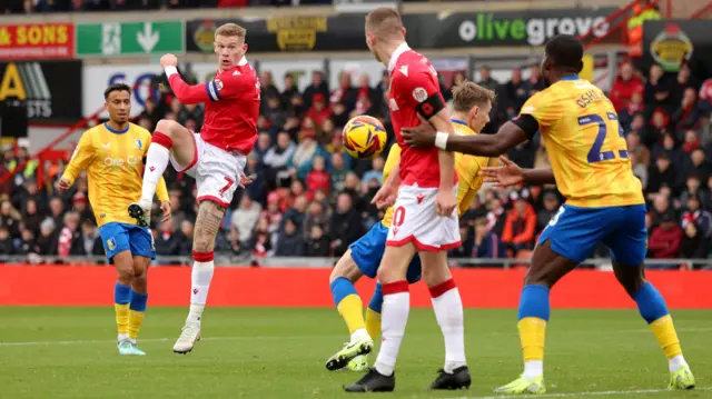 Wrexham's James McClean has an attempt at goal against Mansfield