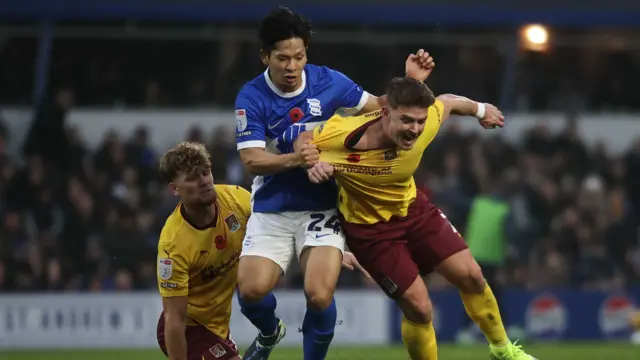 Birmingham's Tomoki Iwata pulls back Northampton's Sam Hoskins