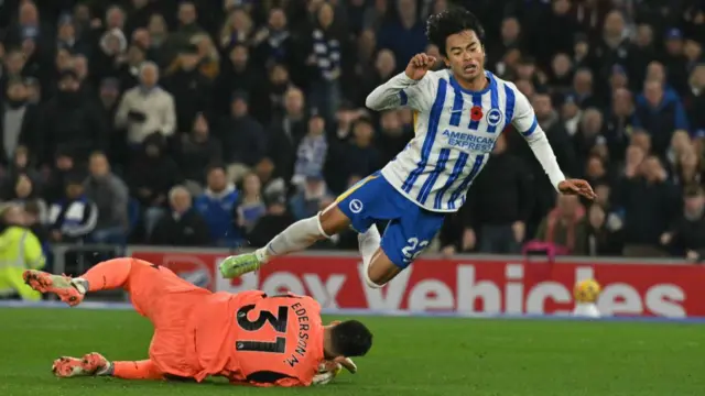 Kaoru Mitoma is denied by Man City goalkeeper Ederson.