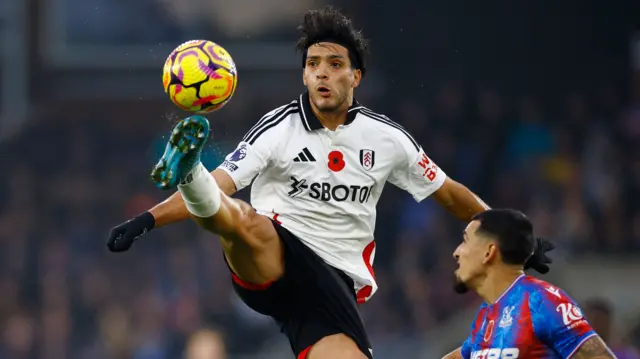 Raul Jimenez of Fulham wins the ball in the air.