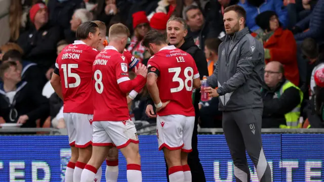 Wrexham manager Phil Parkinson talks to his players