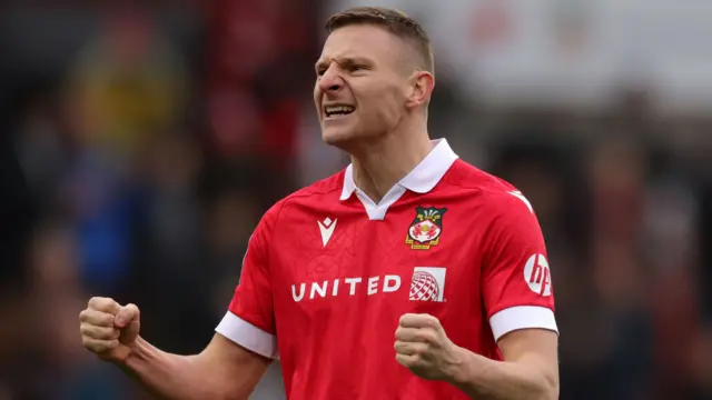 Wrexham striker Paul Mullin celebrates