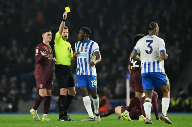 Julio is yellow carded after a foul on Haaland