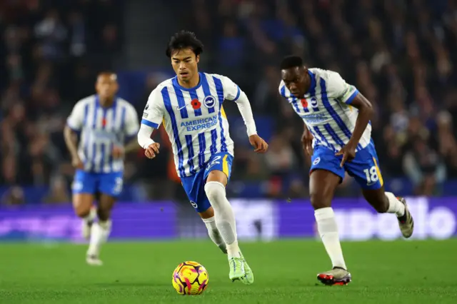 Kaoru Mitoma drives forward for Brighton.