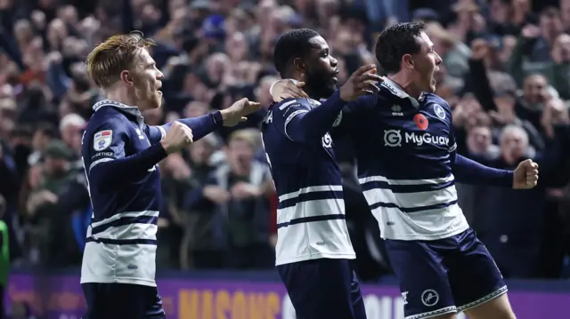 Millwall players celebrate Japhet Tanganga's winner against Leeds