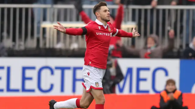 Wrexham goalscorer Ryan Barnett celebrates