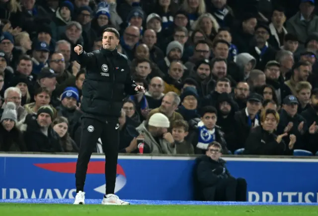 Hurzeler shouts and points instructions on the touchline