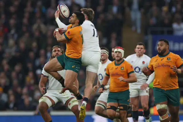 Players contesting in the air for the ball