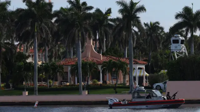 A US Coast Guard boat patrols outside Donald Trump’s residence at Mar-A-Lago