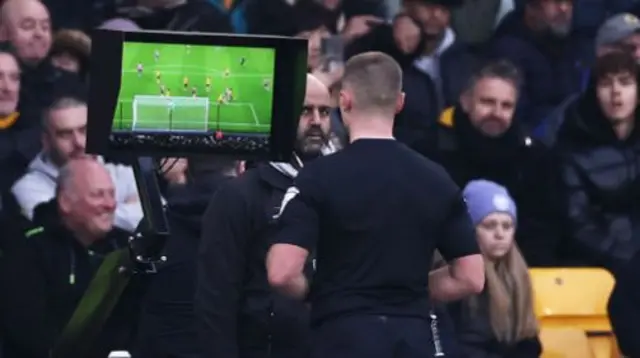 Thomas Bramall views the VAR screen during Wolves v Southampton