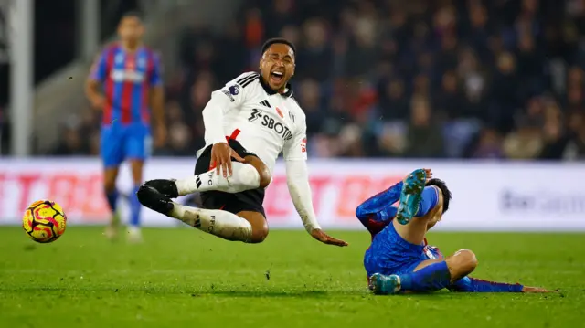 Crystal Palace's Daichi Kamada fouls Fulham's Kenny Tete before being sent off.