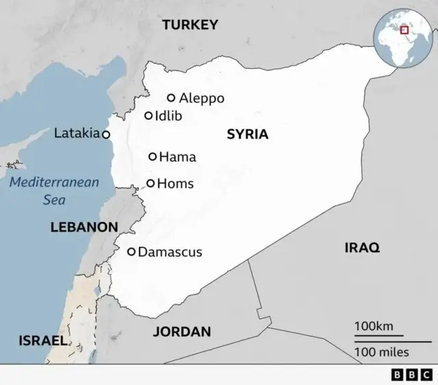 A map showing Syria and some places on it in western Syria. From the north to the south on the west side of Syria, it shows Aleppo, Idlib, Latakia, Hama, Homs, and Damascus. The map shows neighbouring countries to Syria, with Lebanon to the west, Israel in the south-west, Jordan in the south, Iraq in the east, and Turkey in the north.