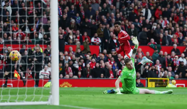 Marcus Rashford scores his second of the game