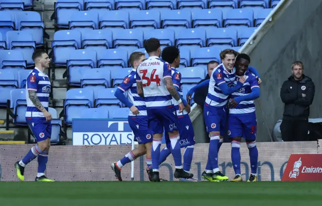 Adrian Akande of Reading celebrates scoring his team's third goal