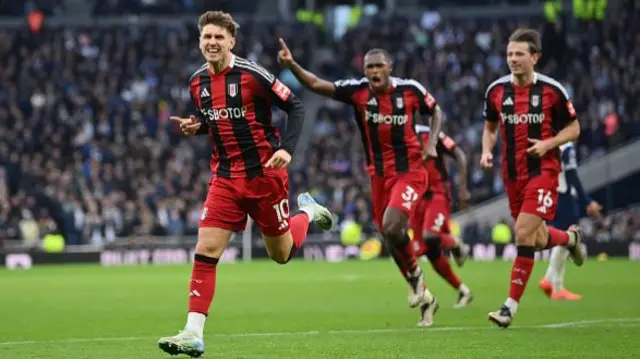 Tom Cairney celebrates for Fulham.