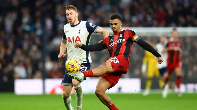 Tottenham Hotspur's Dejan Kulusevski in action with Fulham's Antonee Robinson.