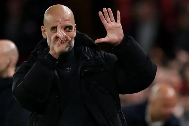 Pep Guardiola gestures with six fingers to Anfield crowd