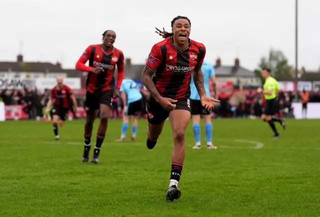 Kettering Town's Isiah Noel-Williams celebrates scoring the opening goal