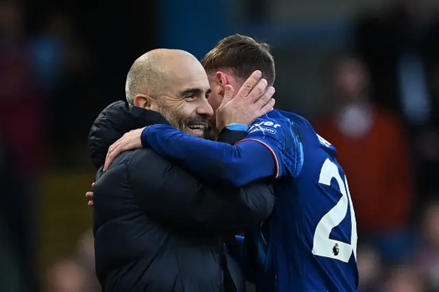 Enzo Maresca, Manager of Chelsea, embraces with Cole Palmer