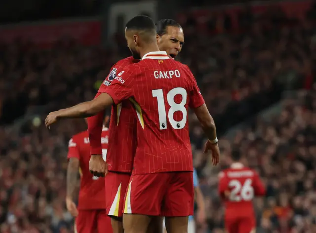 Liverpool's Cody Gakpo celebrates scoring their first goal with Virgil van Dijk.