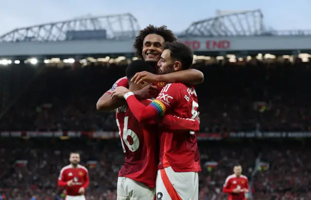 Diallo, Zirkzee and Fernandes celebrate after making it 4-0 to Man United