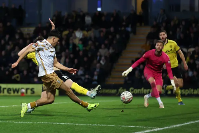 Ronan Maher of Tamworth scores