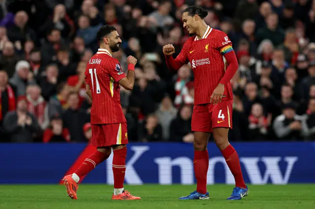 Mohamed Salah (L) celebrates with Liverpool's Dutch defender #04 Virgil van Dijk.